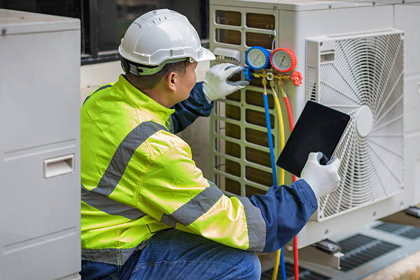 Professional Heat Pump Repair technician working in Coosada, AL